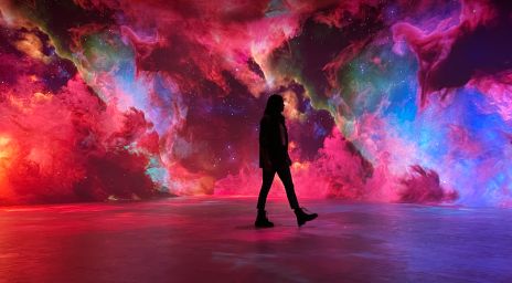 Silhouette of woman in front of Nebula