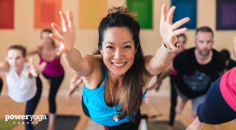 A woman teaching a yoga class