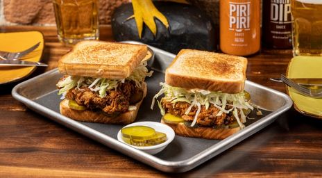 Two chicken sandwiches on a tray